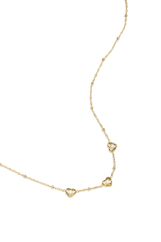 Ketting met bolletjes en hartjes met steen